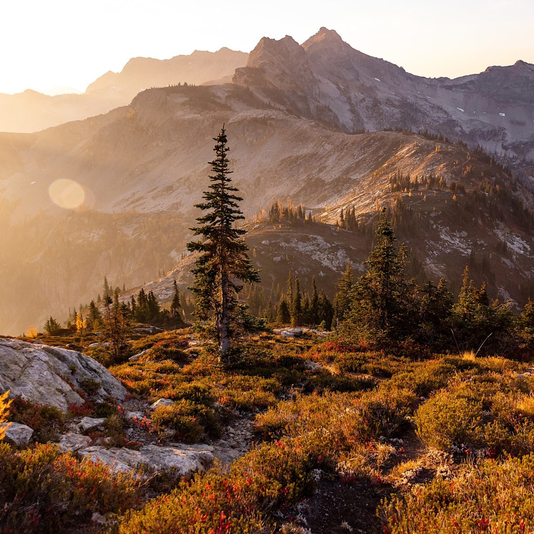 Beautiful colorful fall morning high in mountains during smoke season, Maple Pass, North Cascades National Park, Washington, USA.